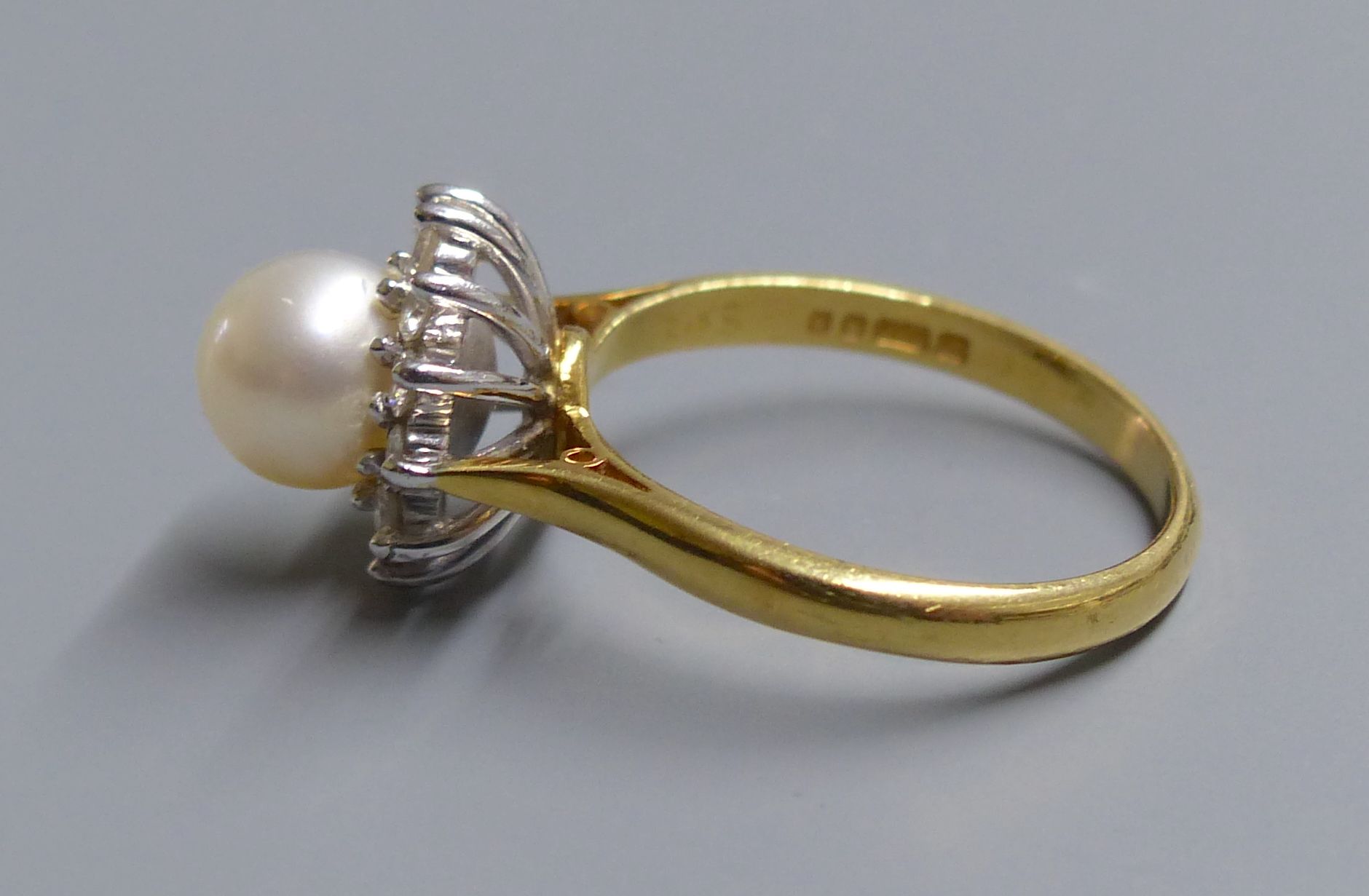 A modern 18ct gold, cultured pearl and diamond set cluster ring, size L, gross 4.4 grams.